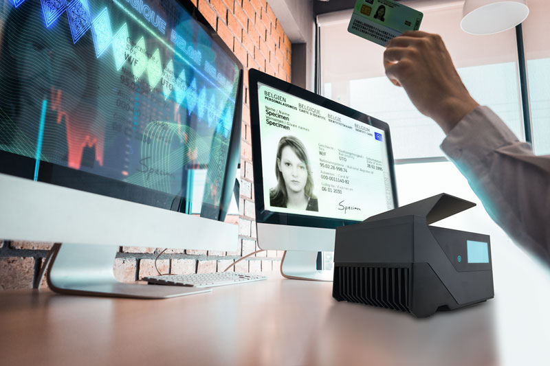 Document-capturing-devices-scanner-and-two-screens-bewerkt Id scanner connected to two desktop screens for automatic identity verfication.