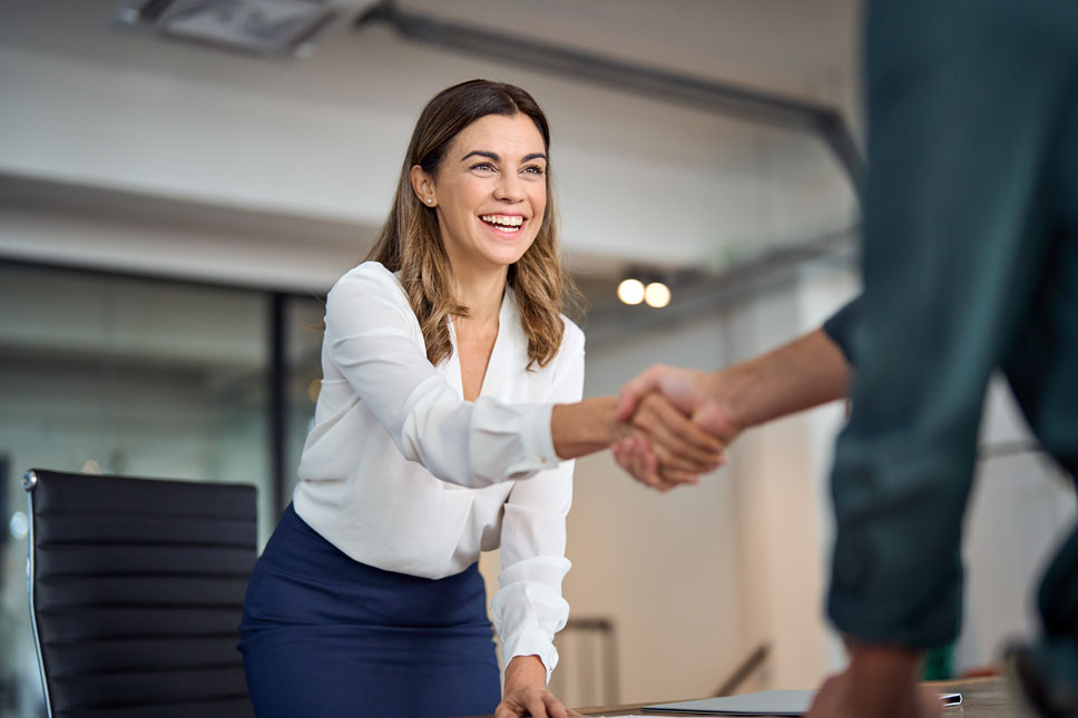 Pre-employment-Screening shaking hands with recruiter.